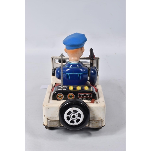 34 - A BOXED NOMURA TN TOYS BATTERY OPERATED TINPLATE STICK SHIFT POLICE JEEP, No.7507, not tested, appea... 