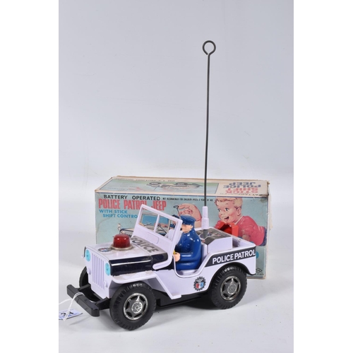 34 - A BOXED NOMURA TN TOYS BATTERY OPERATED TINPLATE STICK SHIFT POLICE JEEP, No.7507, not tested, appea... 