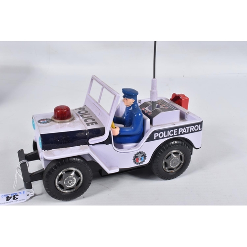 34 - A BOXED NOMURA TN TOYS BATTERY OPERATED TINPLATE STICK SHIFT POLICE JEEP, No.7507, not tested, appea... 