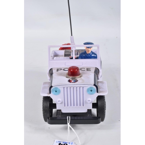 34 - A BOXED NOMURA TN TOYS BATTERY OPERATED TINPLATE STICK SHIFT POLICE JEEP, No.7507, not tested, appea... 