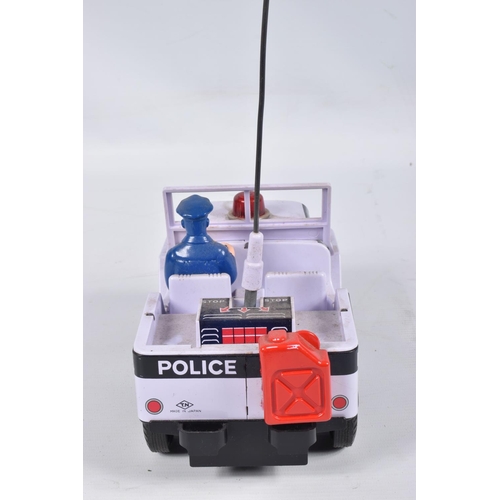 34 - A BOXED NOMURA TN TOYS BATTERY OPERATED TINPLATE STICK SHIFT POLICE JEEP, No.7507, not tested, appea... 