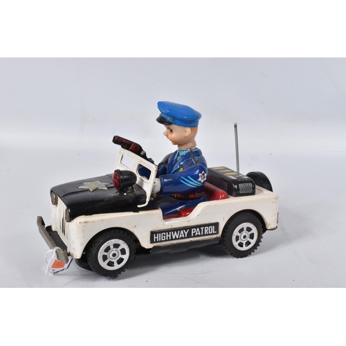 34 - A BOXED NOMURA TN TOYS BATTERY OPERATED TINPLATE STICK SHIFT POLICE JEEP, No.7507, not tested, appea... 