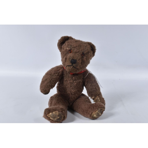 38 - A BROWN WOOL TEDDY BEAR, c. 1950's possibly British or Australian, amber and black glass eyes, shave... 