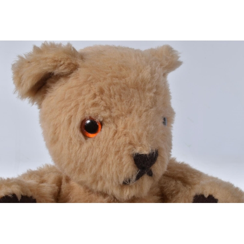 38 - A BROWN WOOL TEDDY BEAR, c. 1950's possibly British or Australian, amber and black glass eyes, shave... 