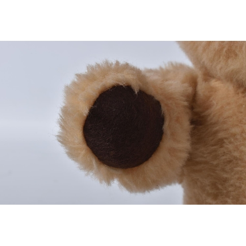 38 - A BROWN WOOL TEDDY BEAR, c. 1950's possibly British or Australian, amber and black glass eyes, shave... 