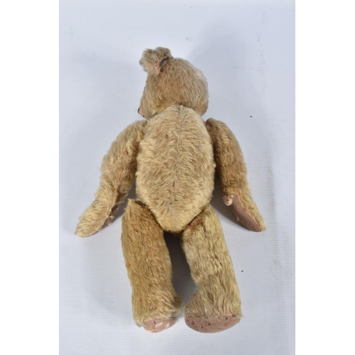 63 - A GERMAN BLONDE MOHAIR TEDDY BEAR, c.1914 - 1920, original glued amber and black glass eyes (both wi... 