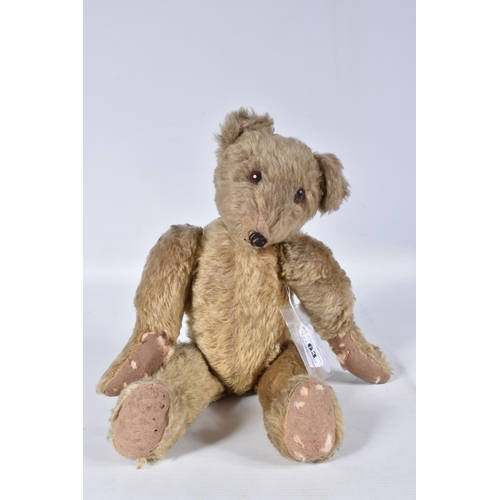 63 - A GERMAN BLONDE MOHAIR TEDDY BEAR, c.1914 - 1920, original glued amber and black glass eyes (both wi... 