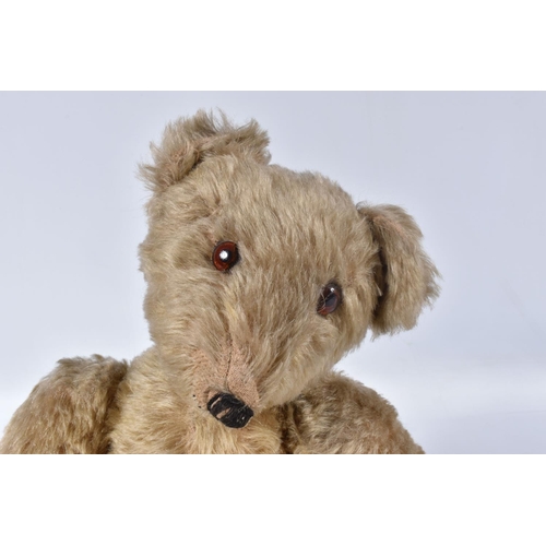 63 - A GERMAN BLONDE MOHAIR TEDDY BEAR, c.1914 - 1920, original glued amber and black glass eyes (both wi... 