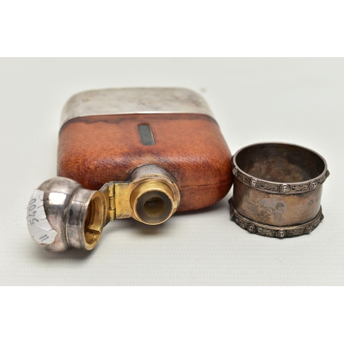 86 - A HIPFLASK AND A SILVER NAPKIN RING, the EPBM 1/4 Pt, glass hipflask with cup, engraved 'Niall From ... 