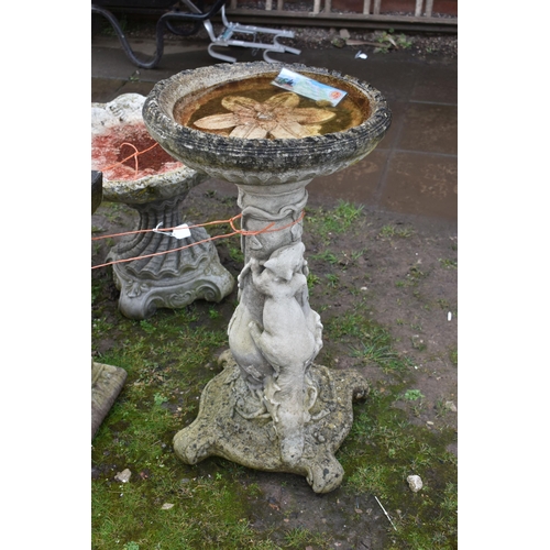 1001 - TWO MODERN COMPOSITE BIRD BATHS one with a tree stump style base, squirrel climbing, leaf and vine o... 