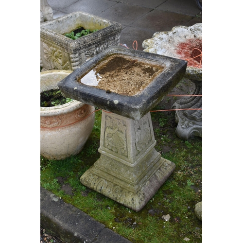 1001 - TWO MODERN COMPOSITE BIRD BATHS one with a tree stump style base, squirrel climbing, leaf and vine o... 