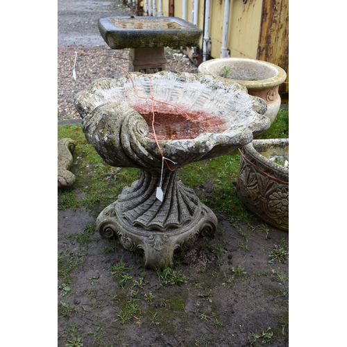 1002 - A MODERN COMPOSITE BIRD BATH in the form of an Oyster shell bowl on a linen swag base with four scro... 