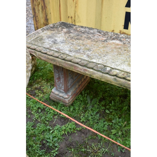 1005 - A MODERN COMPOSITE GARDEN BENCH with rope edges and foliate panels to each rectangular base and rope... 