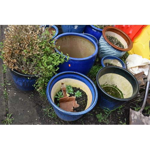 1008 - TWELVE BLUE GLAZED GARDEN PLANT POTS of differing sizes and styles the largest diameter being 41cm (... 