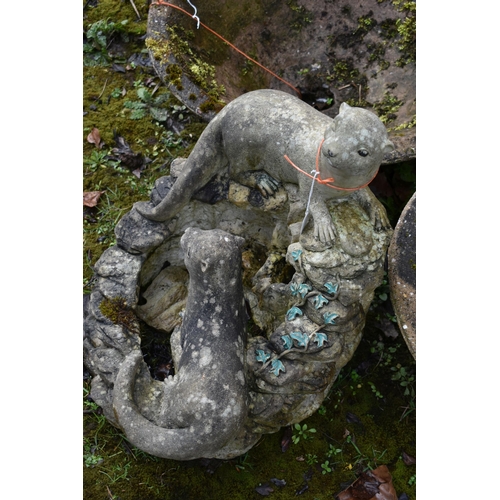 1013 - A MODERN COMPOSITE GARDEN WATER FEATURE in the form of a rockpool with two otters seated height 55cm