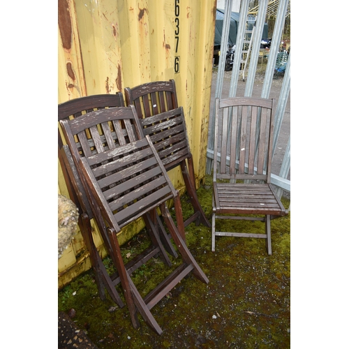 1017 - A SET OF FOUR DISTRESSED FOLDING CHAIRS with slatted wooden seats and backs (4)