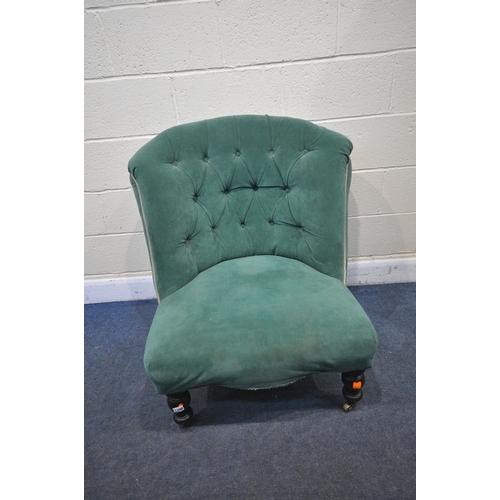 1300 - A VICTORIAN BEDROOM CHAIR, reupholstered in green buttoned fabric, on turned front legs and brass ca... 