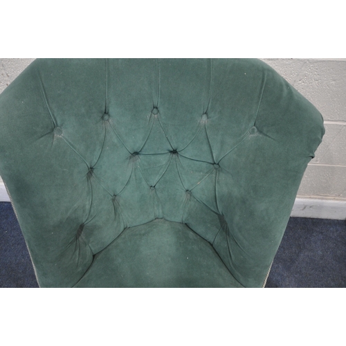 1300 - A VICTORIAN BEDROOM CHAIR, reupholstered in green buttoned fabric, on turned front legs and brass ca... 