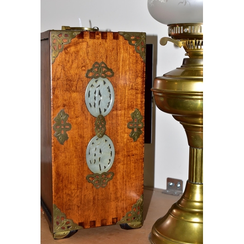 341 - A CHINESE JEWELLERY BOX AND A BRASS BODIED OIL LAMP, the wooden jewellery box having brass handles a... 