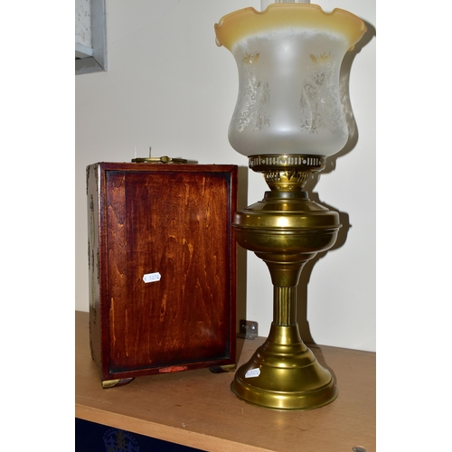 341 - A CHINESE JEWELLERY BOX AND A BRASS BODIED OIL LAMP, the wooden jewellery box having brass handles a... 