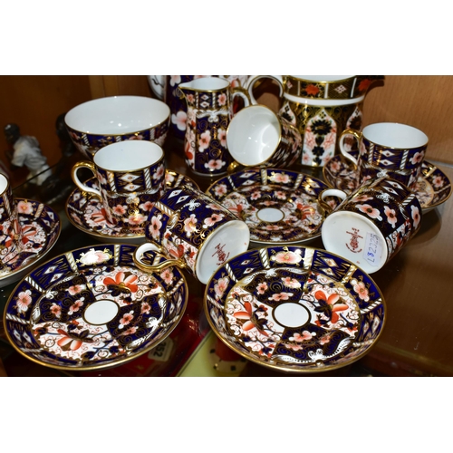 349 - A ROYAL CROWN DERBY TRADITIONAL IMARI 2451 COFFEE SET AND AN OLD IMARI 1128 CREAM JUG, the coffee se... 