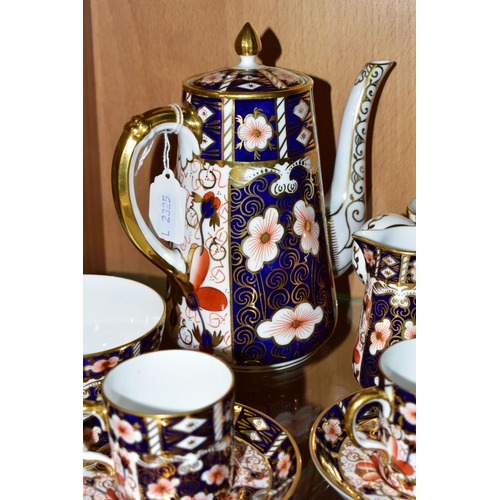 349 - A ROYAL CROWN DERBY TRADITIONAL IMARI 2451 COFFEE SET AND AN OLD IMARI 1128 CREAM JUG, the coffee se... 