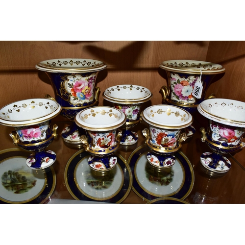 350 - SEVEN VICTORIAN PORCELAIN TWIN HANDLED URNS, hand painted with panels of flowers on a fish scale blu... 