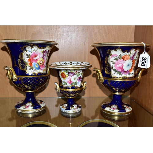 350 - SEVEN VICTORIAN PORCELAIN TWIN HANDLED URNS, hand painted with panels of flowers on a fish scale blu... 