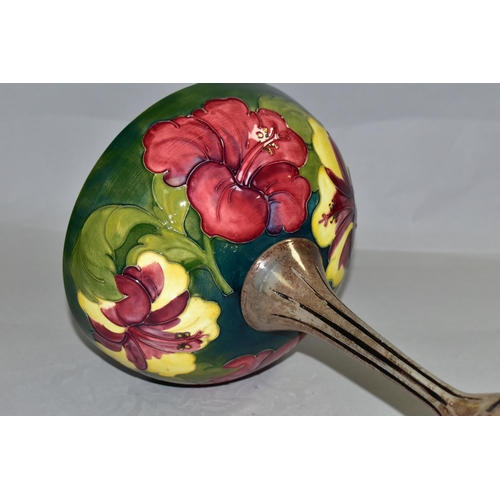 356 - A MOORCROFT POTTERY BOWL DECORATED WITH RED AND YELLOW HIBISCUS ON A GREEN GROUND, the interior of t... 