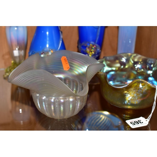 365 - A COLLECTION OF DECORATIVE GLASSWARES, comprising an iridescent yellow glass bowl with wavy rim in t... 