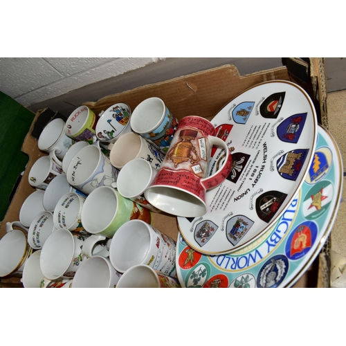 375 - TWO BOXES OF WELSH RUGBY UNION THEMED CERAMICS AND GIFTWARE, to include twenty three mugs, two cabin... 