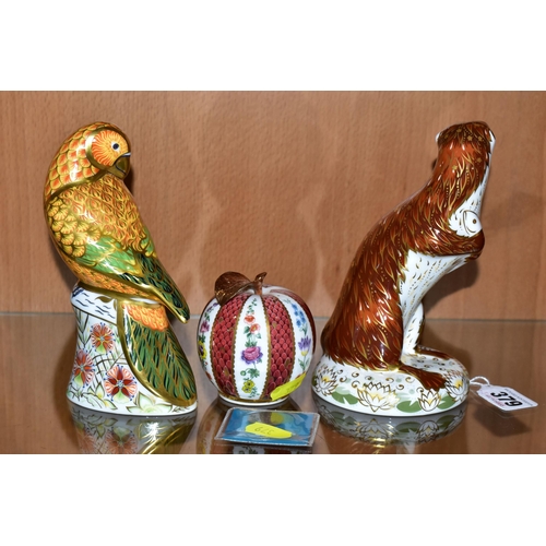 379 - TWO ROYAL CROWN DERBY PAPERWEIGHTS AND A ROYAL WORCESTER CANDLE SNUFFER, comprising 'Playful Otter' ... 