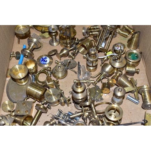 381 - ONE BOX OF MINIATURE BRASS ORNAMENTS, (doll's house pieces) to include oil lamps, roulette wheel, po... 