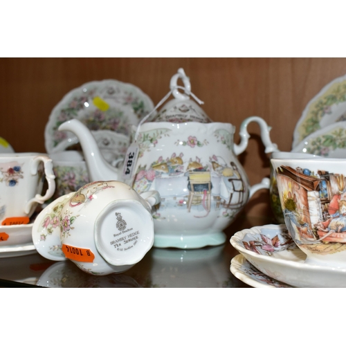 384 - A ROYAL DOULTON TEA SERVIC FROM THE BRAMBLEY HEDGE GIFT COLLECTION, comprising a teapot, four cups, ... 