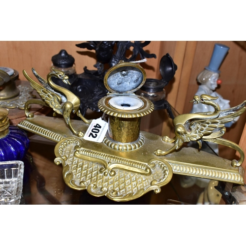 402 - A GROUP OF 20TH CENTURY INK STANDS AND INKWELLS, comprising a cast black ink stand in the form of a ... 