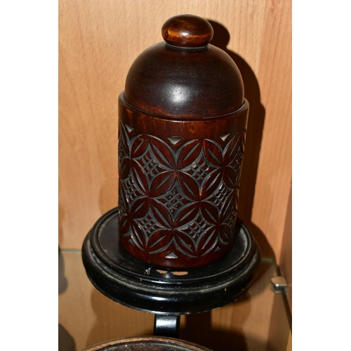 403 - A QUANTITY OF WOODEN VASE STANDS, comprising an Arts & Crafts style tobacco jar with carved detail, ... 