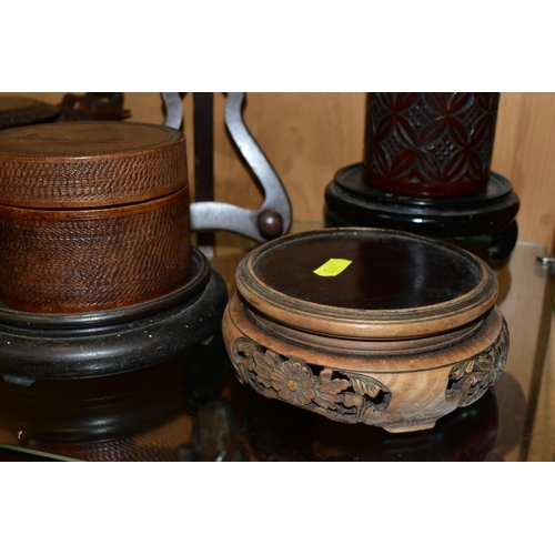 403 - A QUANTITY OF WOODEN VASE STANDS, comprising an Arts & Crafts style tobacco jar with carved detail, ... 