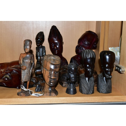 404 - A COLLECTION OF CARVED HARDWOOD ORIENTAL AND TRIBAL WALL MASKS BUSTS AND FIGURINES, comprising seven... 