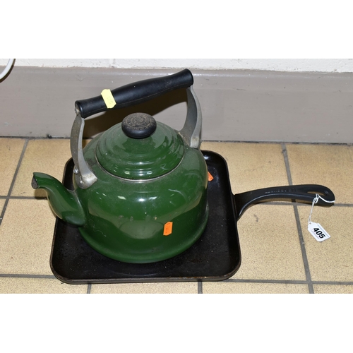 405 - A CAST IRON GRIDDLE PAN AND LE CREUSET KETTLE, a dark green 2.1 litre Le Creuset kettle suitable for... 