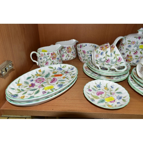 414 - A MINTON 'HADDON HALL 'PATTERN TEA SET, comprising three oval sandwich plates (two marked as second ... 