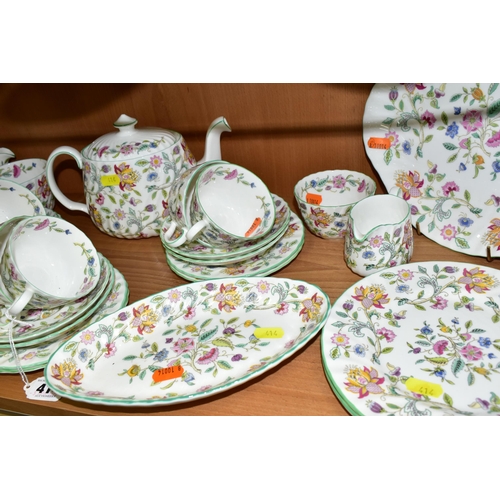 414 - A MINTON 'HADDON HALL 'PATTERN TEA SET, comprising three oval sandwich plates (two marked as second ... 