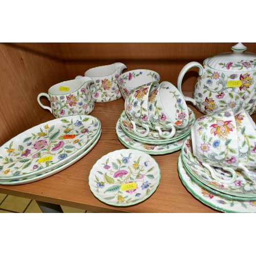 414 - A MINTON 'HADDON HALL 'PATTERN TEA SET, comprising three oval sandwich plates (two marked as second ... 