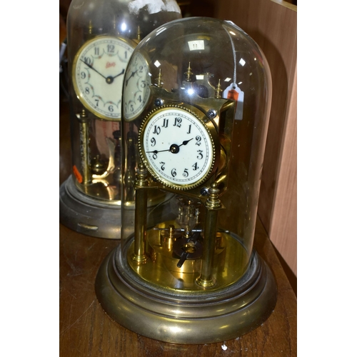 430 - TWO BRASS ANNIVERSARY CLOCKS, comprising one with a glass dome mechanism marked 72632, with key (gla... 