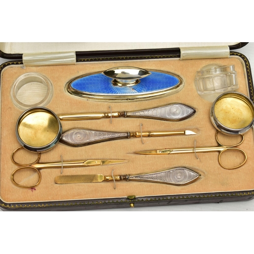 153 - AN EARLY 20TH CENTURY CASED SILVER GUILLOCHE ENAMEL MANICURE SET, eight piece set comprising of cuti... 