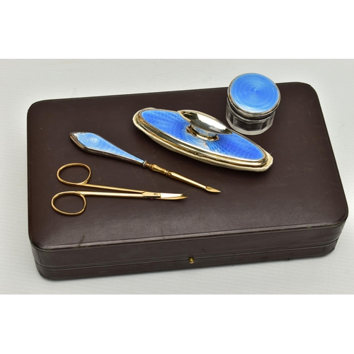 153 - AN EARLY 20TH CENTURY CASED SILVER GUILLOCHE ENAMEL MANICURE SET, eight piece set comprising of cuti... 