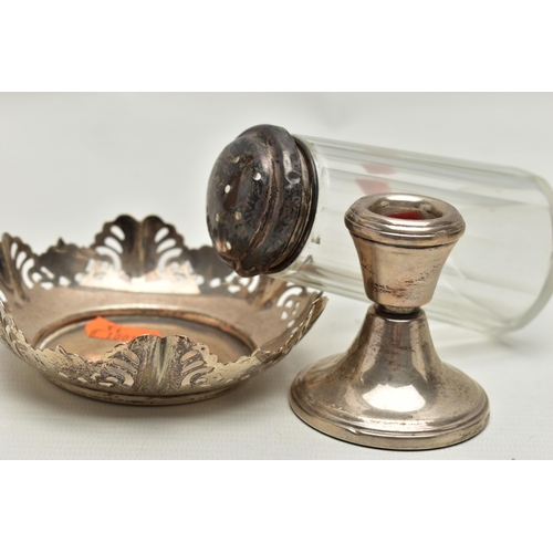 161 - A SILVER NUT DISH, SUGAR CASTER AND A CANDLESTICK, a  round dish with pierecd rasied rim, hallmarked... 