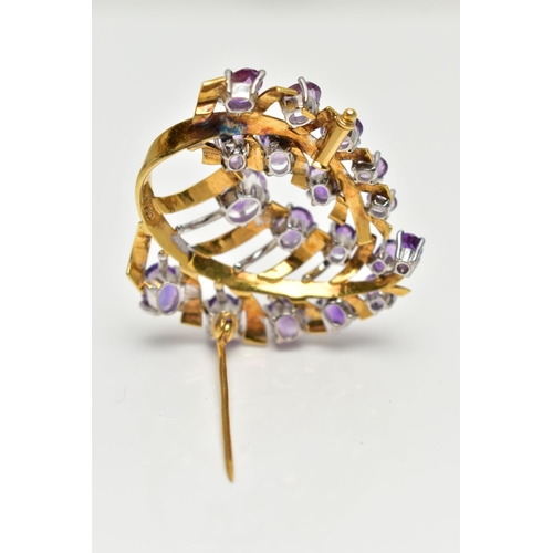 20 - A YELLOW METAL AMETHYST 'LOTOS' SPRAY BROOCH, foliage spray design set with eighteen oval cut amethy... 