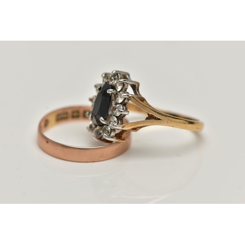 22 - TWO 9CT GOLD RINGS, the first an oval cluster ring, centring on a four claw set, oval cut deep blue ... 