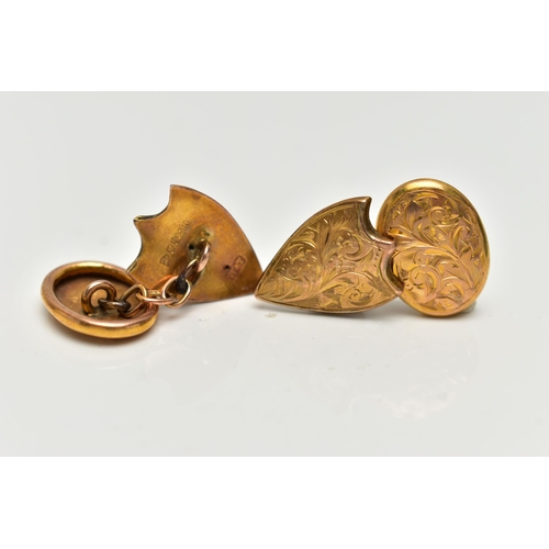 33 - A PAIR OF EARLY 20TH CENTURY 9CT GOLD CUFFLINKS, each cufflink designed with an oval and a shield sh... 