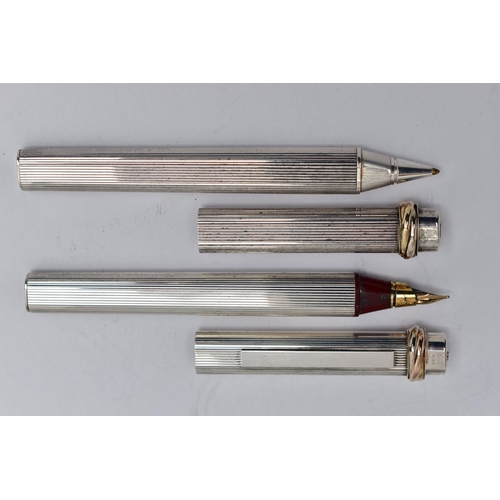 40 - A PAIR OF 'CARTIER' LES DE MUST VENDOME TRINITY PENS, a fountain pen, bugandy resin, silver tone cas... 